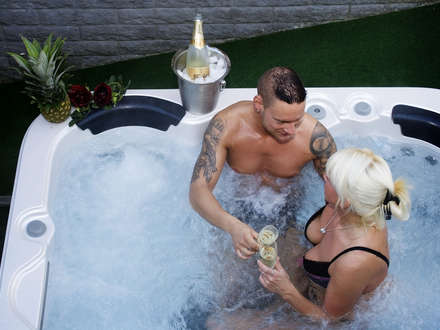 Wellness Oasis: Sip champagne in the hot tub