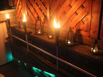 Wellness Oasis: Torch light by the hot tub